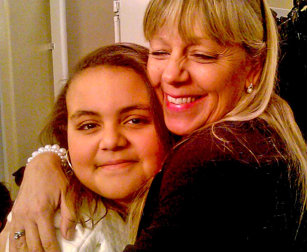 OAFS adoptee Carolyn hugging her birth grandmother